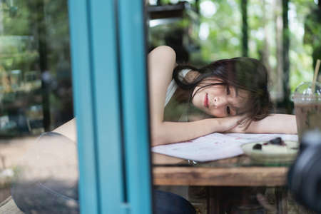 portrait of beautiful asian women at the coffee shop, fashion women conceptの写真素材