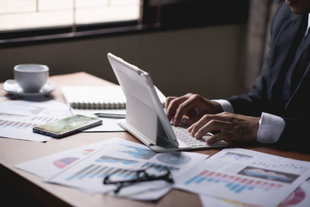 business man working with laptop on the table