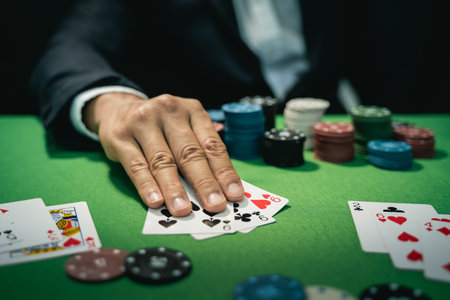 Man dealer or croupier shuffles poker cards in a casino on the background of a table, poker game...