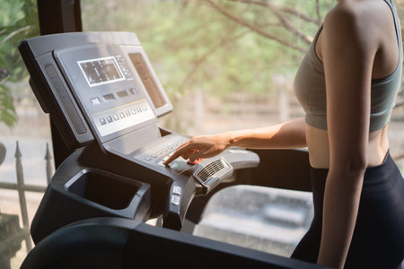 beautiful women exercise training with treadmill in the gym, sport fitness concept