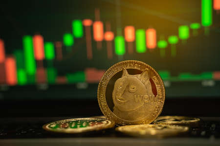 Bitcoin gold coin and defocused chart background, cryptocurrency conceptの写真素材