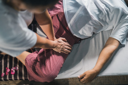 Massage and spa relaxing treatment of office syndrome traditional thai massage style. Asain senior...