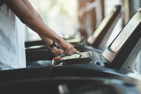 Asian sport man using dumbbell exercise at gym. Asian body building for muscle training.  Sport health gym conceptの写真素材
