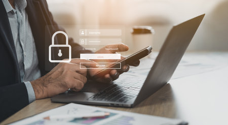 Business man working on mobile phone and laptop. Cybersecurity Global ...