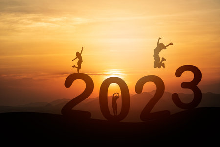 Woman jump happy new year 2023 concept, silhouette of woman jumping over barrier cliff and success...