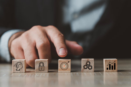 Business man point finger to wood block target icon. Business startup with growth success process for Leadership concept. Wooden cube blocks. Goal sign strategy icon. Business goal success concept.の写真素材
