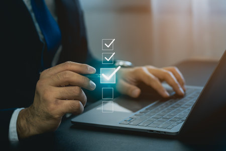 Businessman using digital pen to tick correct sign mark in virtual checkbox screen for quality document control checklist and business approve project. Businessman Take an assessment, questionnaire.の写真素材
