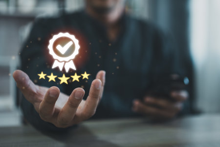 Man using mobile virtual icon providing five-star premium service. Using smart phone showing award high standards are guaranteed, service quality, the assurance five stars. Guarantee the quality.の写真素材
