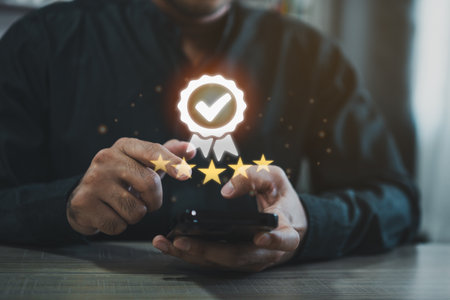 Man using mobile virtual icon providing five-star premium service. Using smart phone showing award high standards are guaranteed, service quality, the assurance five stars. Guarantee the quality.の写真素材