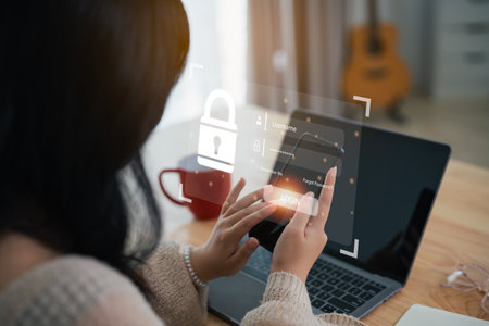 Businesswoman use mobile phone and laptop to access, information security and encryption, secure access user's personal information, Internet access, cybersecurity. Cyber security technology concept.の写真素材