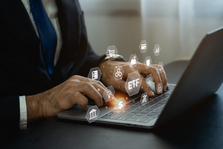 Businessman wearing suit working laptop Person to ETF Exchange traded fund stock market trading...