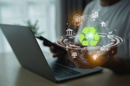 Man holding earth use laptop recycle virtual screen symbol modern reduce CO2 emission with icons,...