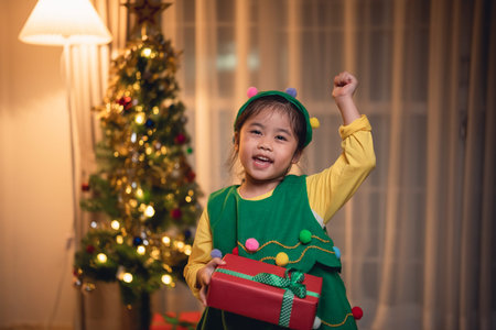 Christmas, x-mas, winter concept. Asian baby child girl holding gift boxes smiling happy cheerful....