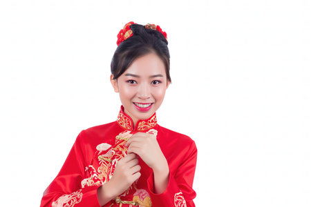 Portrait photography. Asian Chinese woman smiling in traditional cheongsam qipao dress on White or grey background. Chinese new year festival concept.の素材