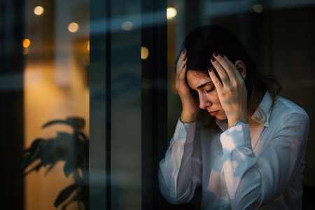 Depressed sadly serious asian business woman having stressful depression sad time working on laptop on office table. Depression woman sad series mental health from working concept.の素材
