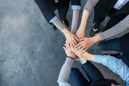 Close up business people putting their hands together for success, deal, unity, cooperation, Teamwork. Top view Business concept.の写真素材