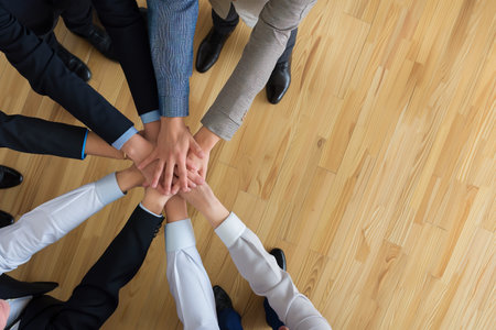 Close up business people putting their hands together for success, deal, unity, cooperation, Teamwork. Top view Business concept.の写真素材