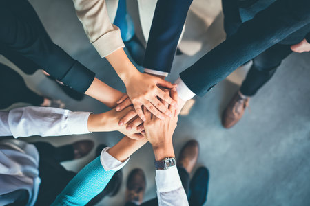 Close up business people putting their hands together for success, deal, unity, cooperation, Teamwork. Top view Business concept.の写真素材