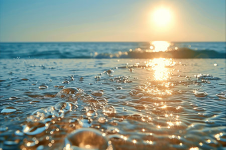 Sparkling Water Droplets with Sun Reflection. Macro shot capturing the dynamic energy of water droplets against a bright, sunlit blue backdrop.の素材