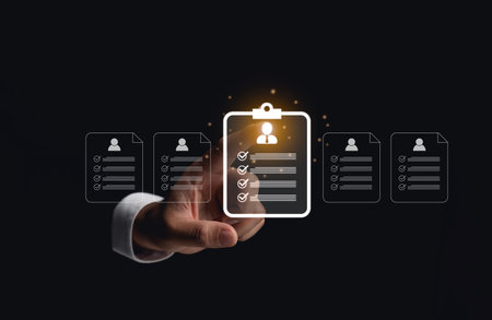 Hand Selecting Glowing HR Document Icons. A hand touching a glowing clipboard icon among multiple HR documents on a dark background. HR professional to selective career recruitment human resource.の写真素材