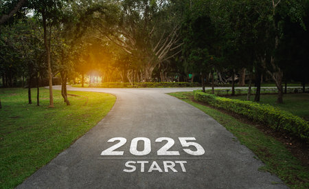 Happy new year, 2025 symbolizes the start of the new year. The letter start new year 2025 on the road in the nature route roadway have tree environment ecology or greenery wallpaper concept.の写真素材