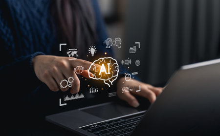 Close-up woman hand point finger interacting with laptop showcasing digital icons representing artificial intelligence and technology concepts in a modern workspace environmentの写真素材