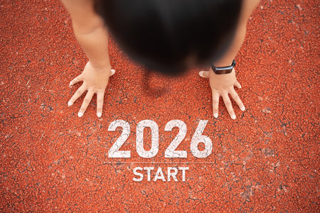 Athlete Preparing to Start Race on Track, Focus on Hands in Starting Position for Competitive Sports Eventの写真素材