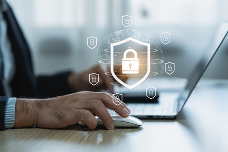 Modern cybersecurity concept showcasing hands using laptop with digital padlock icons representing...