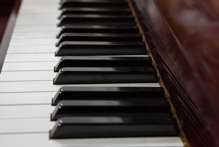 Close-up or macro image of piano keys by selective focus technique can be seen the details of classic instruments used in both Jazz and pop music which background and foreground are blurred.の写真素材