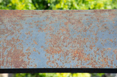 Top view and close shot of rusted metal beam installed at high level shows the beautiful texture and colorful surface. The steel structure has been abandoned outdoor which is deteriorated and aged.の写真素材