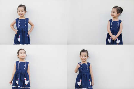 Sets or groups of photo of cute asian girl with a bright blue dress, contrasting with the skin color and beautiful smile on white background and copy space that everyone will fall in love.の写真素材