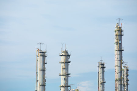 Close up and up-view shot with copy space of tall towers made of metal and stainless steel for...