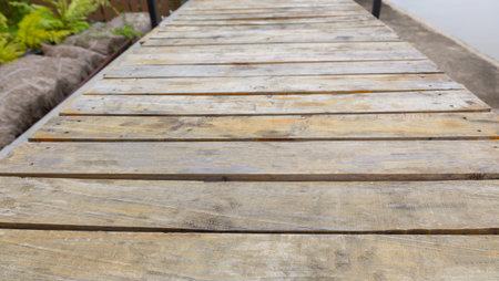 Perspective view of authentic old, vintage and grunge wood board built for table with beautiful...