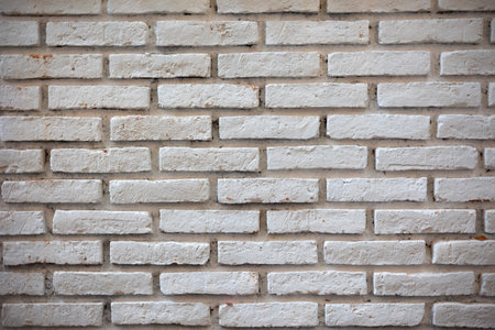 Front view and close up shot of concrete and with stack and row of brick wall shows pattern and...