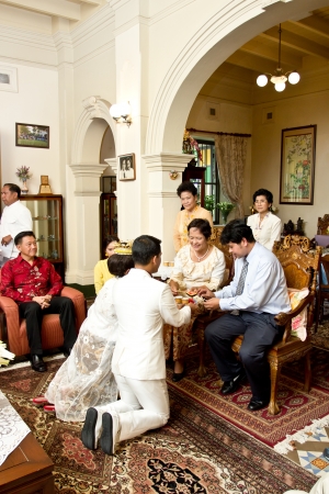 PHUKET THAILAND june 23:Unidentified associate in the  Phuket traditional 
Baba styled wedding is a ceremony which brings happiness and joy for the 
parents and family of the bride and groom.on June 23,2013 at old Phuket town 
in Phuket Thailand. のeditorial素材
