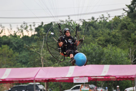 PHUKET,THAILAND - NOVEMBER 15: Unidentified competitor of the 4th Asian Beach Game Test Event for Paramotor (CAT II)on November 15, 2013 in Phuket,Thailandのeditorial素材
