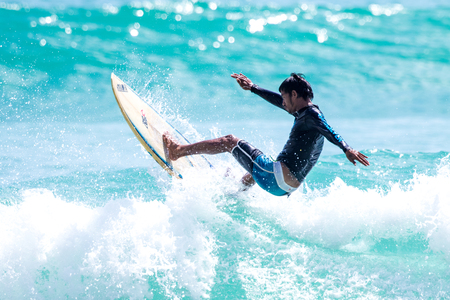 PHUKET - JUN 06: unidentified surfer in action catching 
waves in rainy season at Kata beach Phuket on jun 06, 2016 
in Kata beach, Phuket, Thailand.のeditorial素材