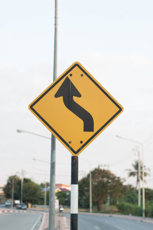 Sharp reverse curves ahead sign on roadの写真素材 [40068875571]｜毎月1点無料（フリー）の ...