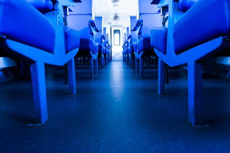Inside the Train with fully open carriage, Open style blue passenger seating on a Thai train. Old design of railway carriagesの写真素材