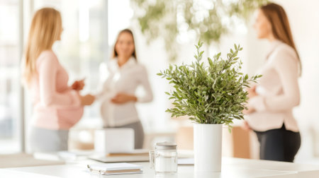 Pregnant woman in bright modern office setting with colleagues, copy space background, AI Generatedの素材