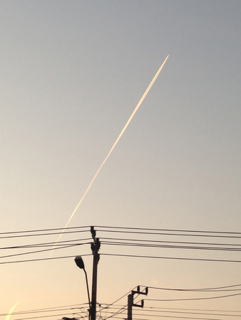 contrails of aircraft against a blue sky. routes in airwaysの写真素材