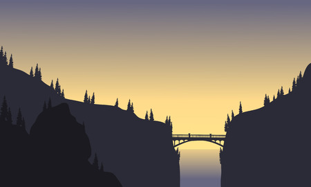 Silhouette of bridge connecting two cliffs at afternoonのイラスト素材