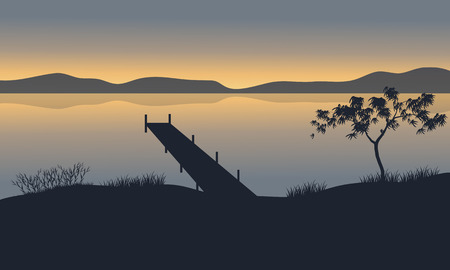 Silhouette of pier in lake at the sunsetのイラスト素材