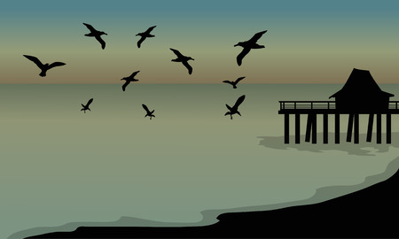 silhouette of huts and bird at the beach at the afternoonのイラスト素材