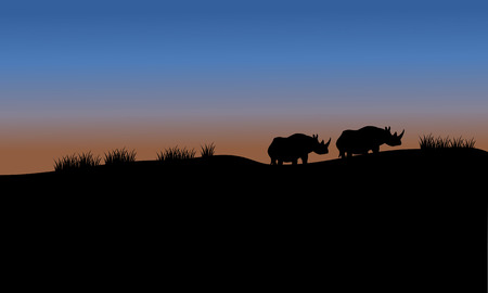 Rhino in fields scenery silhouette with blue skyのイラスト素材