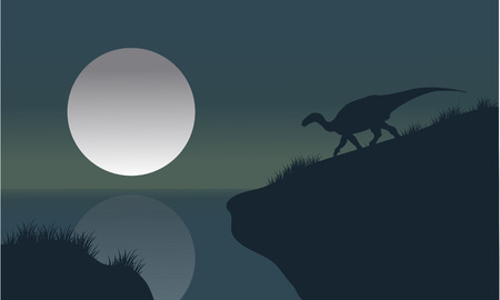 Iguanodon in riverbank with moon silhouette scenery a beautifulのイラスト素材