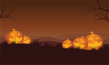Silhouette of Halloween orange pumpkins in hills vectorのイラスト素材