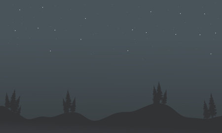 Silhouette of trees in hill scenery at night