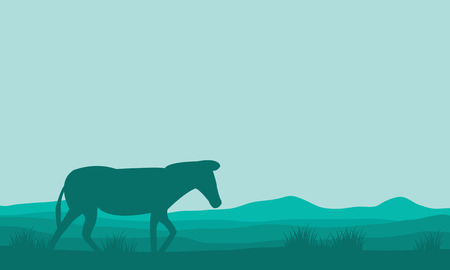 Silhouette of single zebra in hills on green backgroundsのイラスト素材