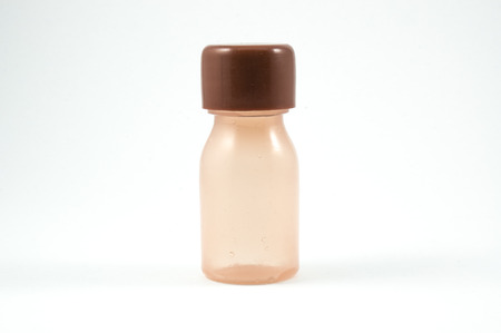 brown hotel cosmetic bottle isolated on whiteの写真素材